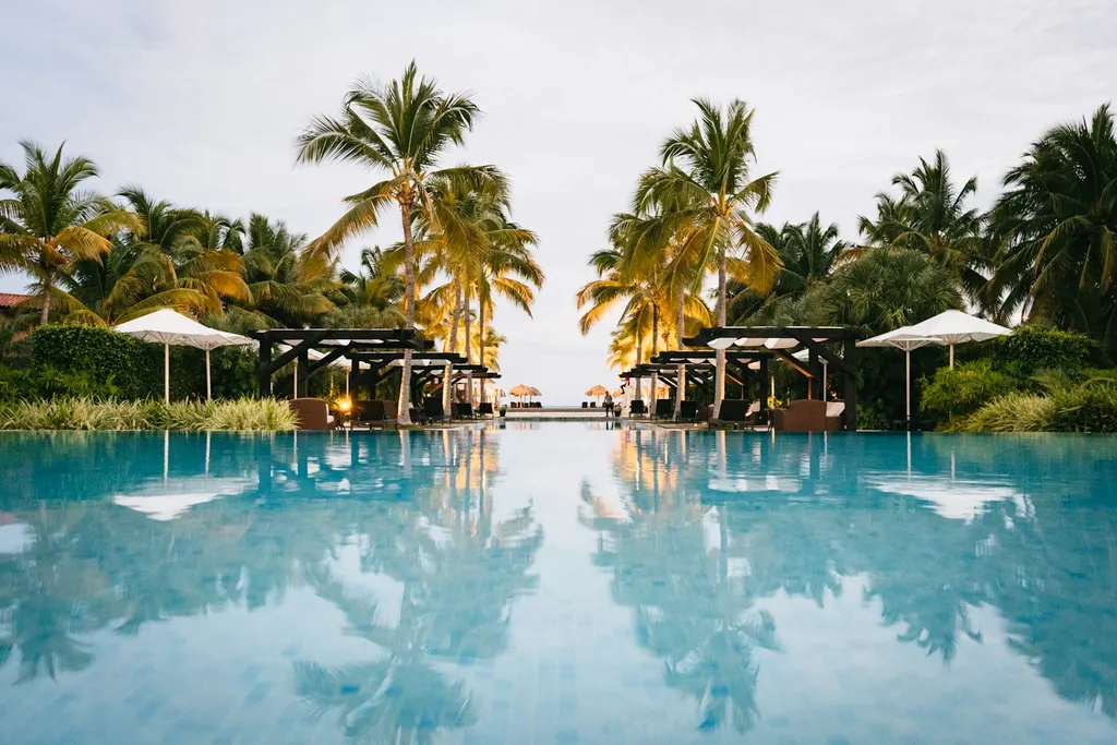 A busy day-club pool at peak demand